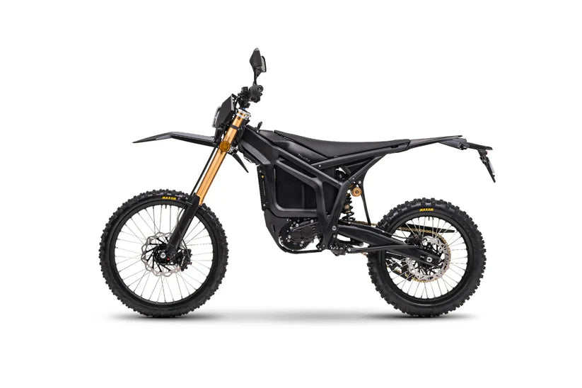 Black Komodo L3 electric dirt bike side view with gold forks and knobby tires